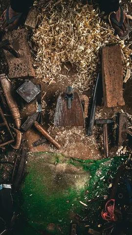 Wood shavings gather around the tools of a working day.