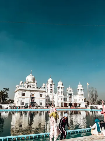White domes reflected in the water below.
