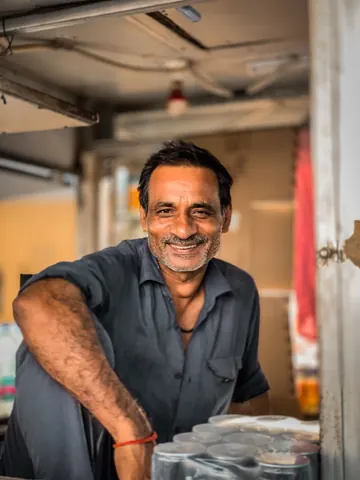 A welcoming smile across the shop counter.