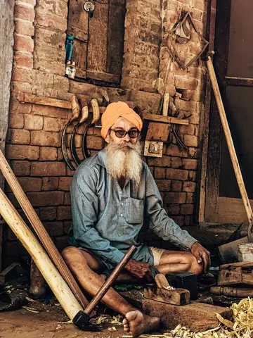 A quiet moment against the workshop's brick walls.