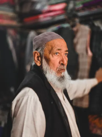 Soft light catches an elder's face.