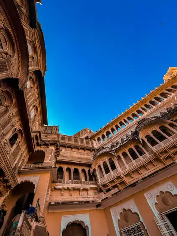 Looking up through layers of arches and balconies.