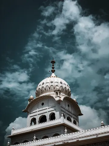 A white dome beneath a dramatic sky.