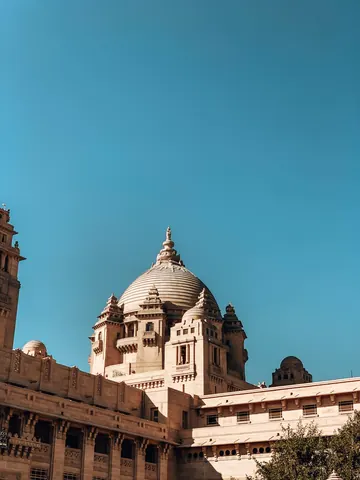 A stone dome rises above an arcaded courtyard.